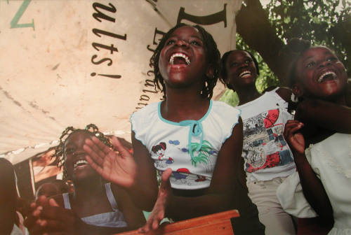 Children Enjoy a Performance