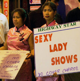 Borderless Captivity, Bargirls and touts appeal to passersby, Pattaya, Thailand