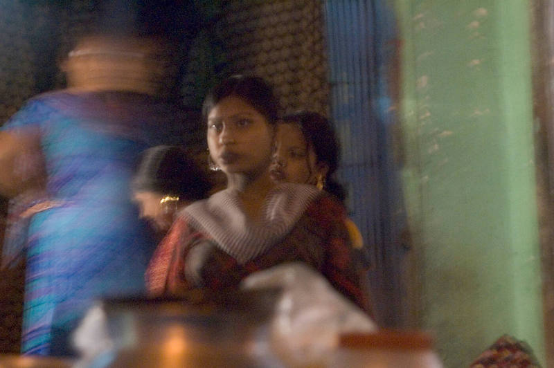 Borderless Captivity, Women awaits customer in red light district, Mumbai, India