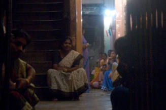 Borderless Captivity, View inside brothel with Madam and girls, Mumbai, India